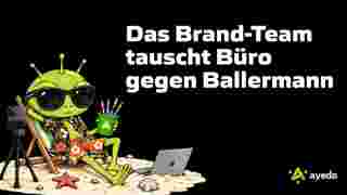 ayedo alien as a Brand Team member on the beach with a laptop and camera